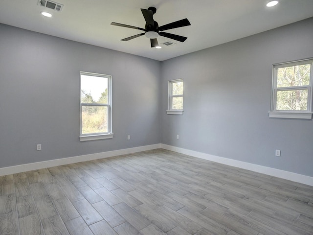 empty room with light hardwood / wood-style floors and ceiling fan