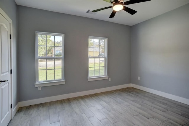 unfurnished room featuring light hardwood / wood-style flooring and ceiling fan