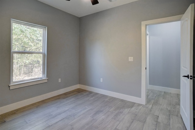 unfurnished room featuring ceiling fan and light hardwood / wood-style flooring