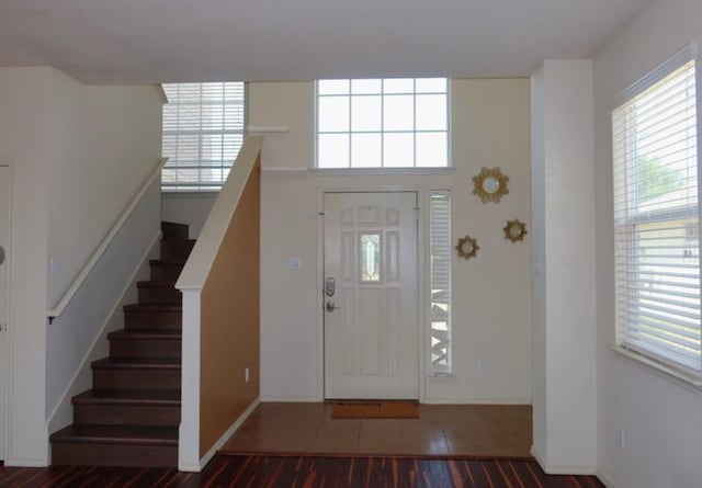 foyer entrance featuring dark hardwood / wood-style floors