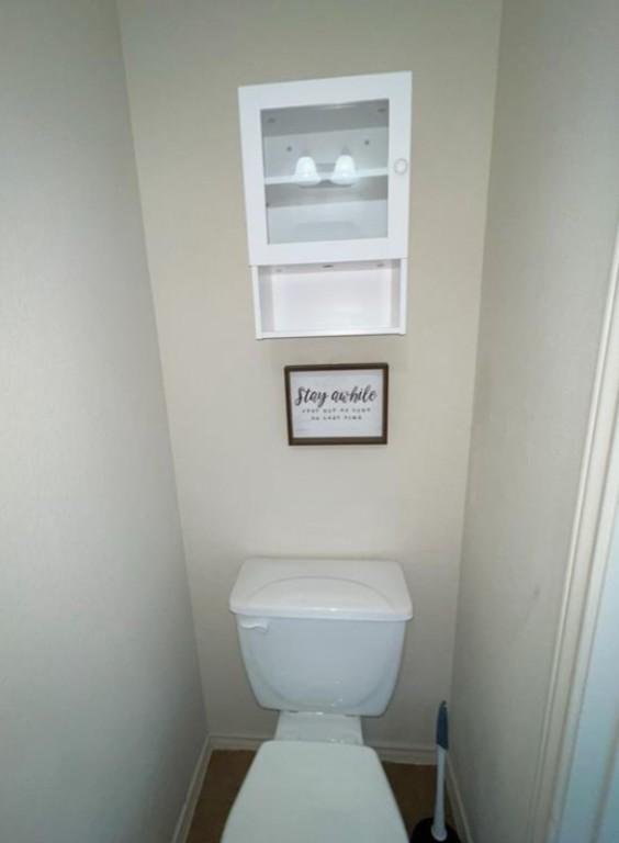 248 Coal Dr, Jarrell, TX 76537 - bathroom featuring toilet and baseboards