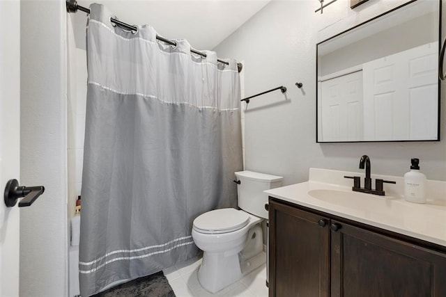 bathroom with vanity, a shower with shower curtain, toilet, and tile patterned flooring