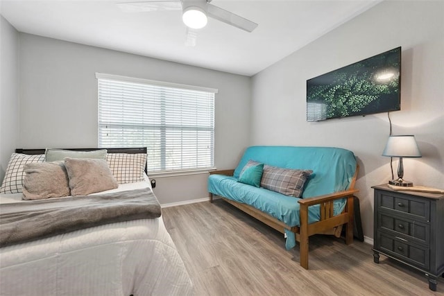 bedroom with hardwood / wood-style floors and ceiling fan