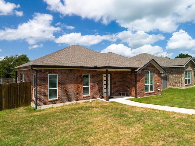 ranch-style home featuring a patio area and a front lawn