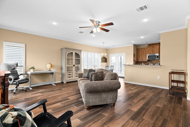 living room with ceiling fan, ornamental molding, and dark hardwood / wood-style floors