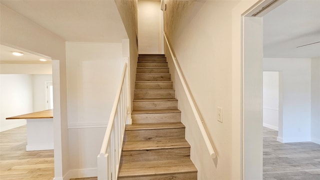 stairway featuring hardwood / wood-style flooring