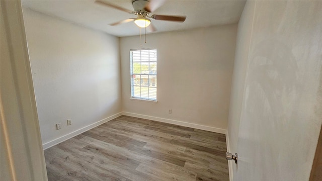 spare room featuring light hardwood / wood-style flooring and ceiling fan