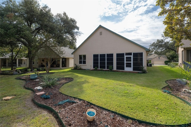 back of house featuring a yard