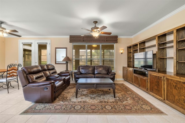 tiled living room with french doors, ceiling fan, and ornamental molding