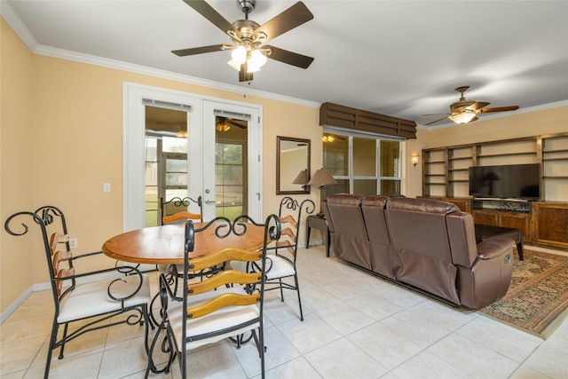 dining space featuring french doors, crown molding, and light tile patterned floors