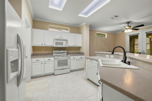 kitchen featuring white cabinets, ceiling fan, ornamental molding, sink, and white appliances