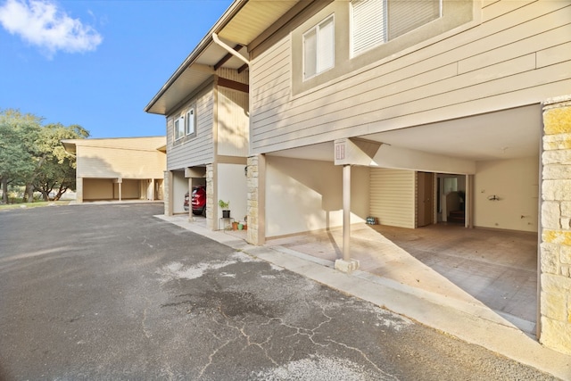 exterior space featuring a carport