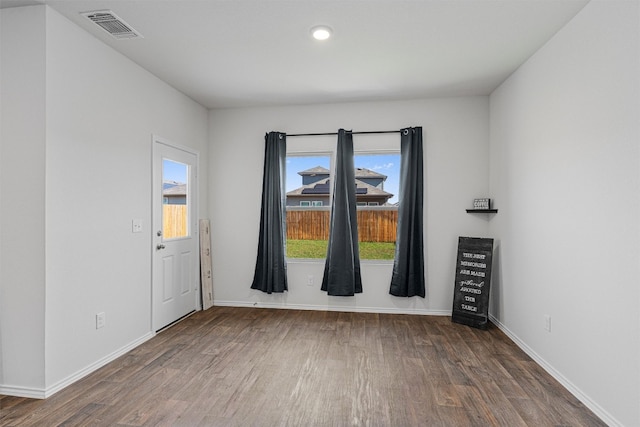 empty room featuring hardwood / wood-style floors