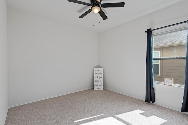 carpeted empty room with ceiling fan