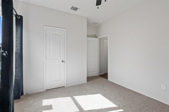 11104 Roving Pass, Elgin, TX 78621 - unfurnished bedroom featuring carpet flooring, baseboards, a ceiling fan, and visible vents