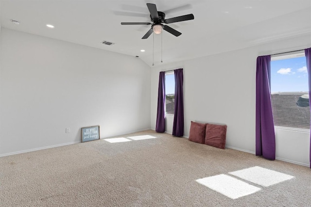 11104 Roving Pass, Elgin, TX 78621 - unfurnished room with ceiling fan, plenty of natural light, carpet flooring, and visible vents