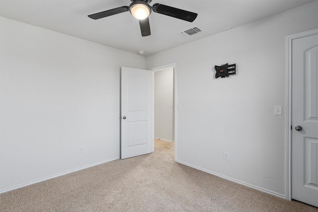 11104 Roving Pass, Elgin, TX 78621 - unfurnished bedroom with light colored carpet, visible vents, baseboards, and ceiling fan