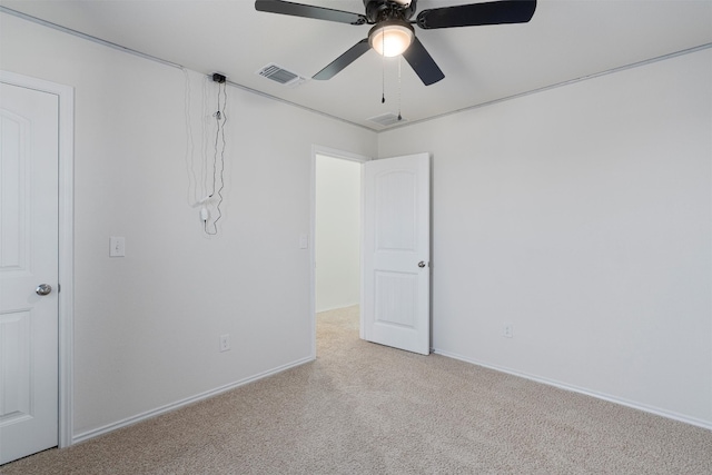 carpeted empty room with ceiling fan