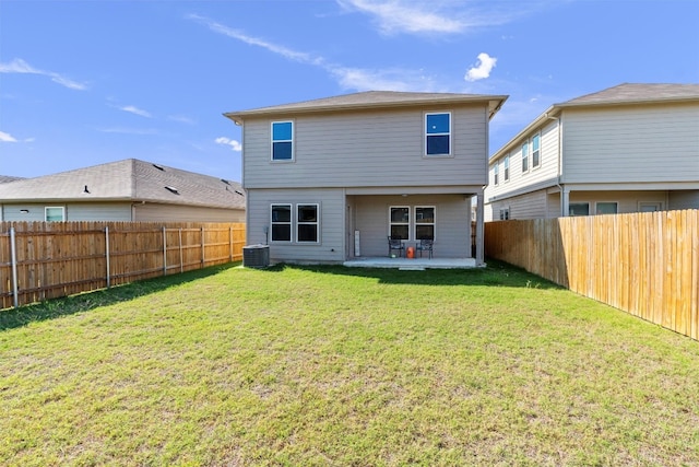 back of house with a yard, a patio area, and central AC unit