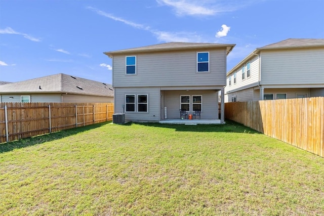 11104 Roving Pass, Elgin, TX 78621 - rear view of property with a lawn, central AC unit, a patio, and a fenced backyard