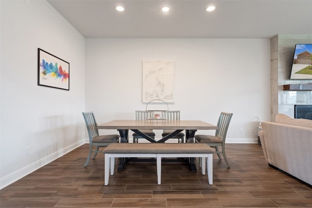 dining area featuring dark wood-type flooring