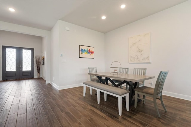 dining space with french doors, baseboards, recessed lighting, and dark wood finished floors