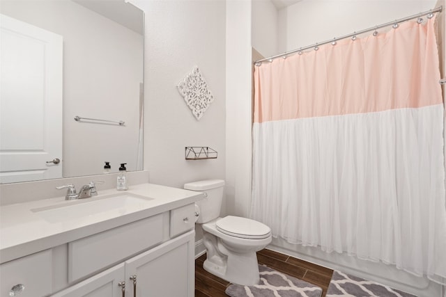 full bathroom featuring toilet, shower / bath combo, vanity, and wood-type flooring