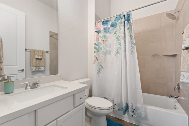 full bathroom featuring shower / bath combo with shower curtain, tile patterned floors, vanity, and toilet