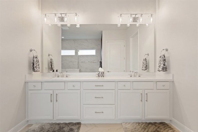 bathroom with walk in shower and vanity