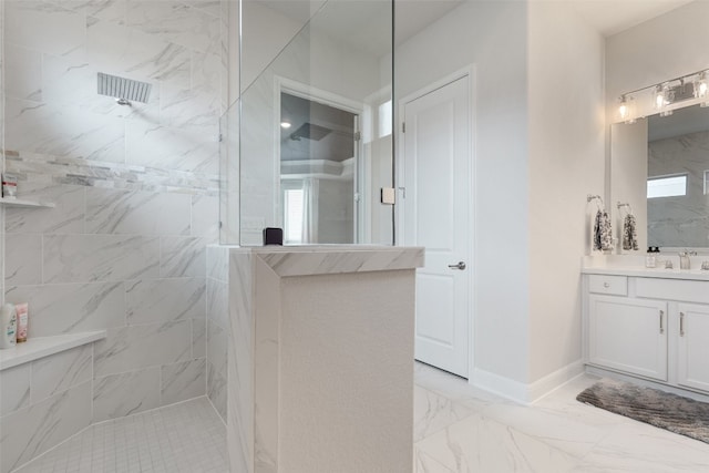 bathroom featuring vanity and tiled shower