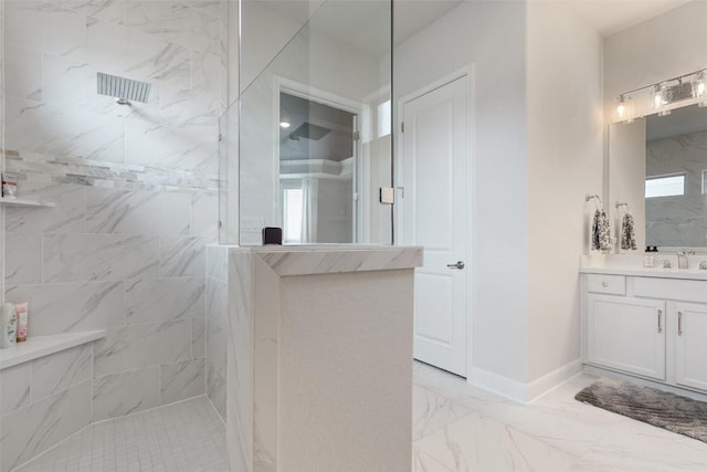 bathroom featuring baseboards, walk in shower, marble finish floor, and vanity
