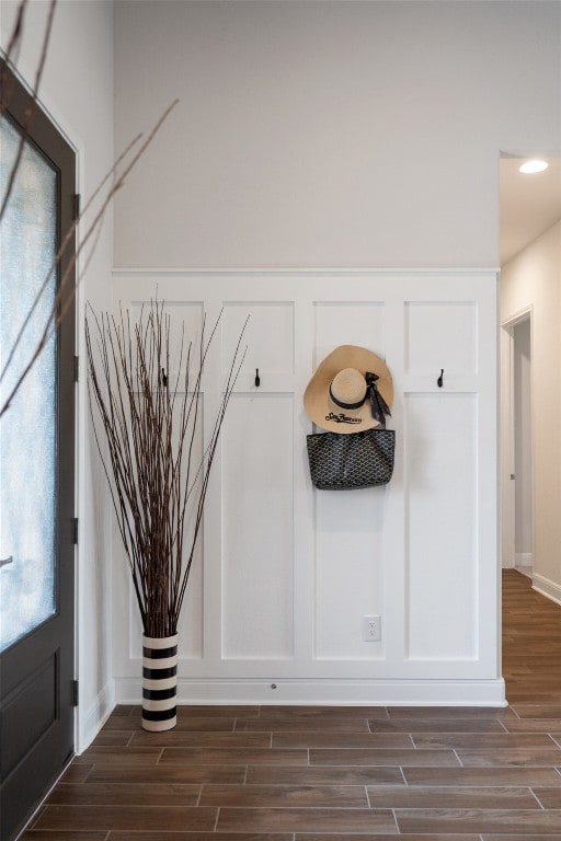 mudroom featuring dark wood-type flooring and a wealth of natural light