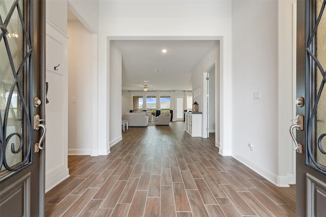 entryway with hardwood / wood-style flooring and ceiling fan