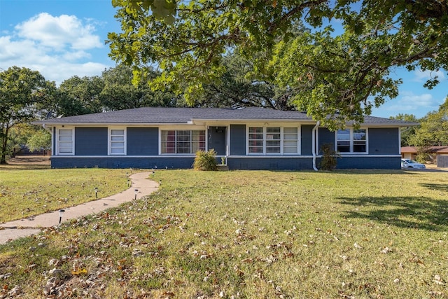 single story home featuring a front yard