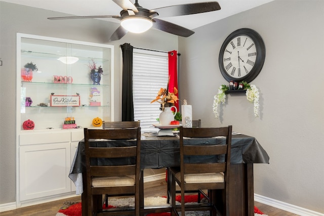 dining area featuring dark hardwood / wood-style floors and ceiling fan