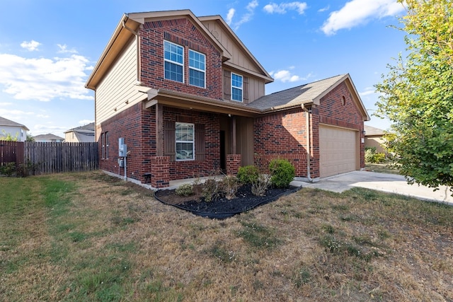 view of front of property featuring a garage and a front yard