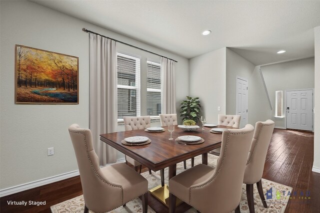 dining space with dark hardwood / wood-style floors