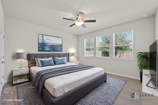 carpeted bedroom featuring ceiling fan