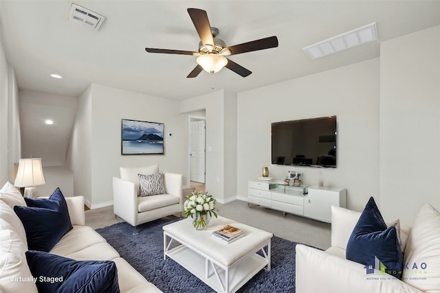 living room with dark colored carpet and ceiling fan