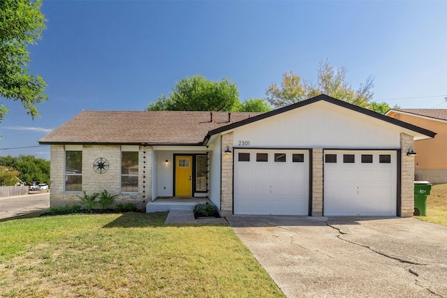 ranch-style home with a front yard and a garage