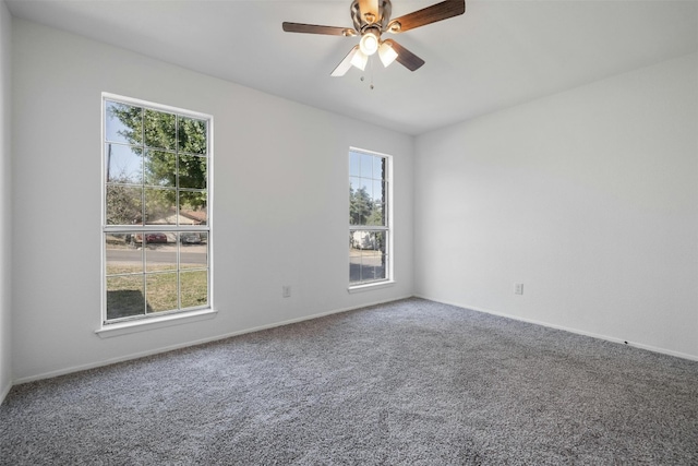 unfurnished room with carpet flooring and ceiling fan