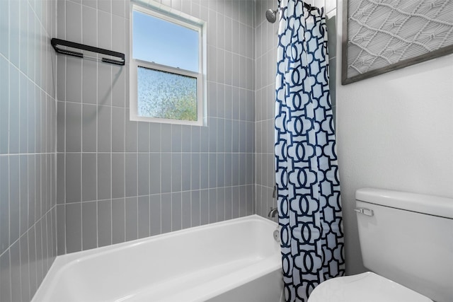 bathroom with toilet and shower / bath combo with shower curtain