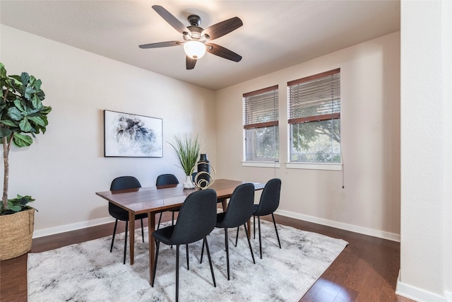 dining space with hardwood / wood-style flooring and ceiling fan