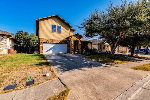 front facade featuring a front yard and a garage