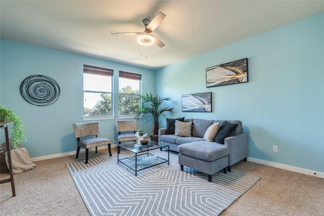 carpeted living room with ceiling fan