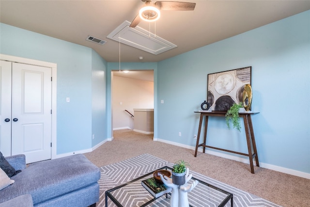 sitting room featuring light colored carpet