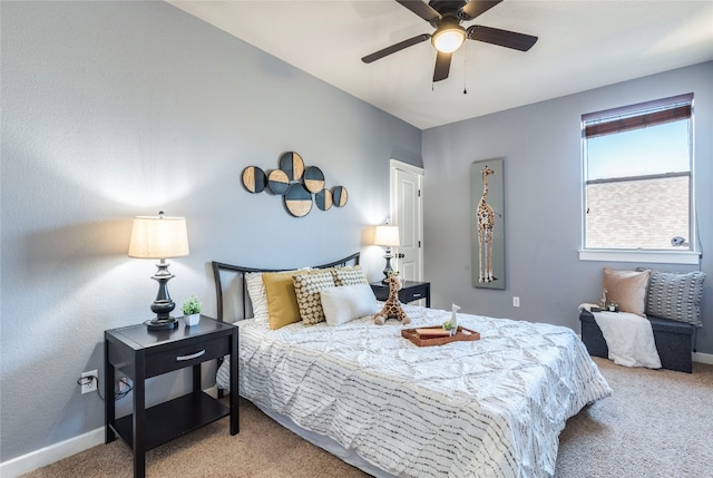 bedroom with ceiling fan and carpet floors