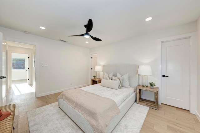 bedroom featuring ceiling fan and light hardwood / wood-style flooring