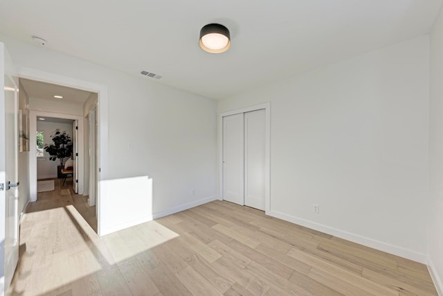 empty room with light wood-type flooring