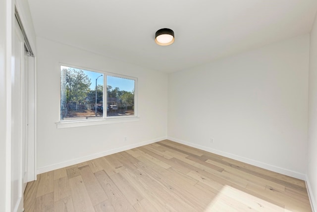 spare room featuring light hardwood / wood-style floors